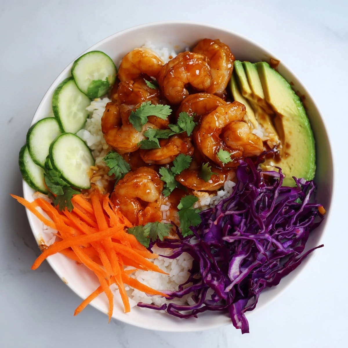 Close-up of saucy Hot Honey Shrimp Bowl—colorful, healthy ingredients create a flavorful bite.