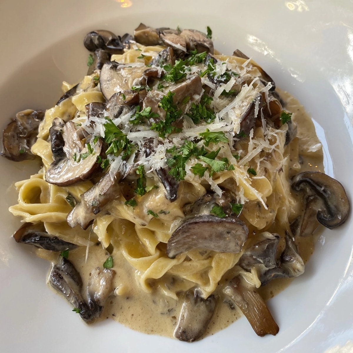 Savor the rich Creamy Truffle Mushroom Pasta: fettuccine tossed in luscious, earthy sauce.