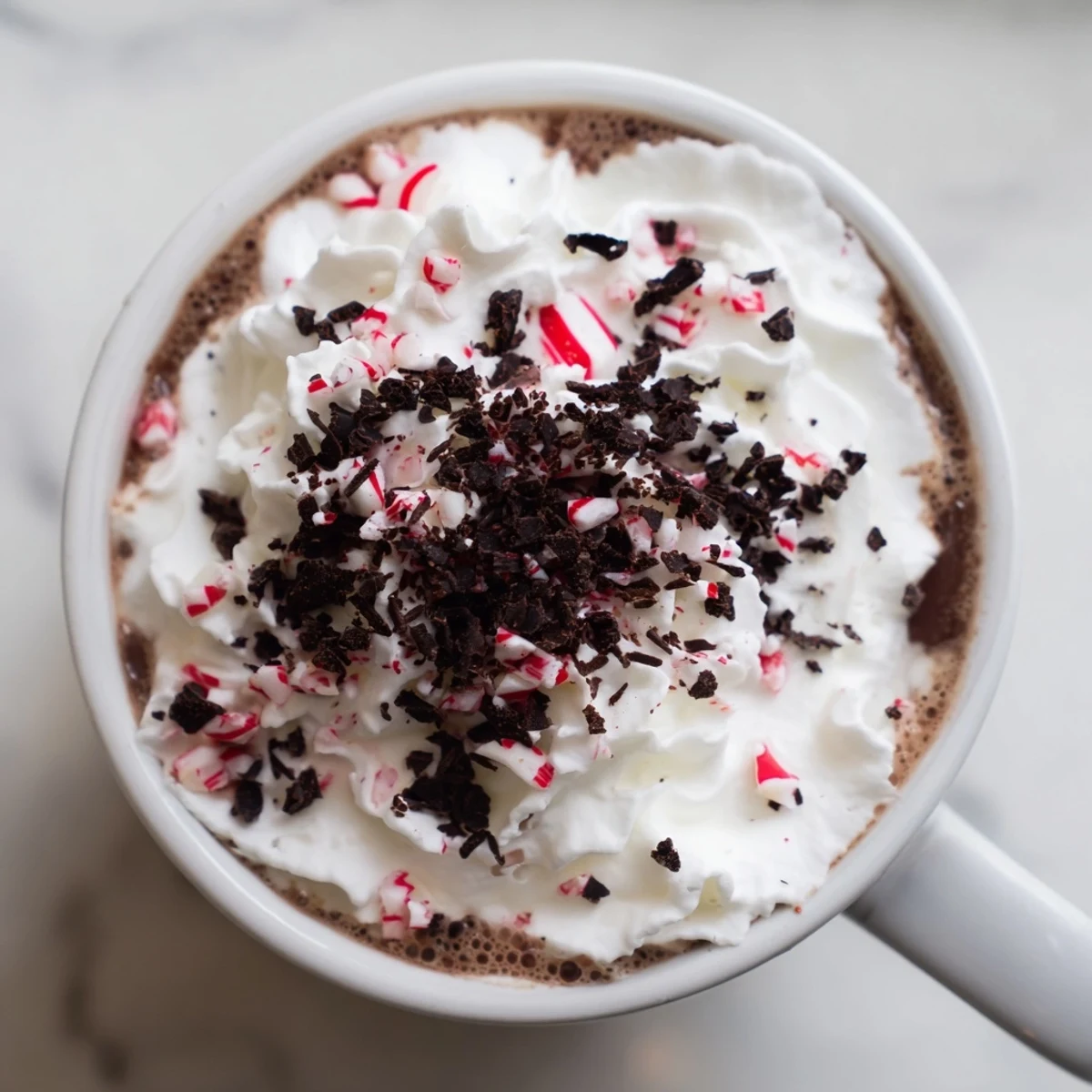 Steaming Peppermint Mocha Latte topped with whipped cream, perfect for cozy winter mornings.