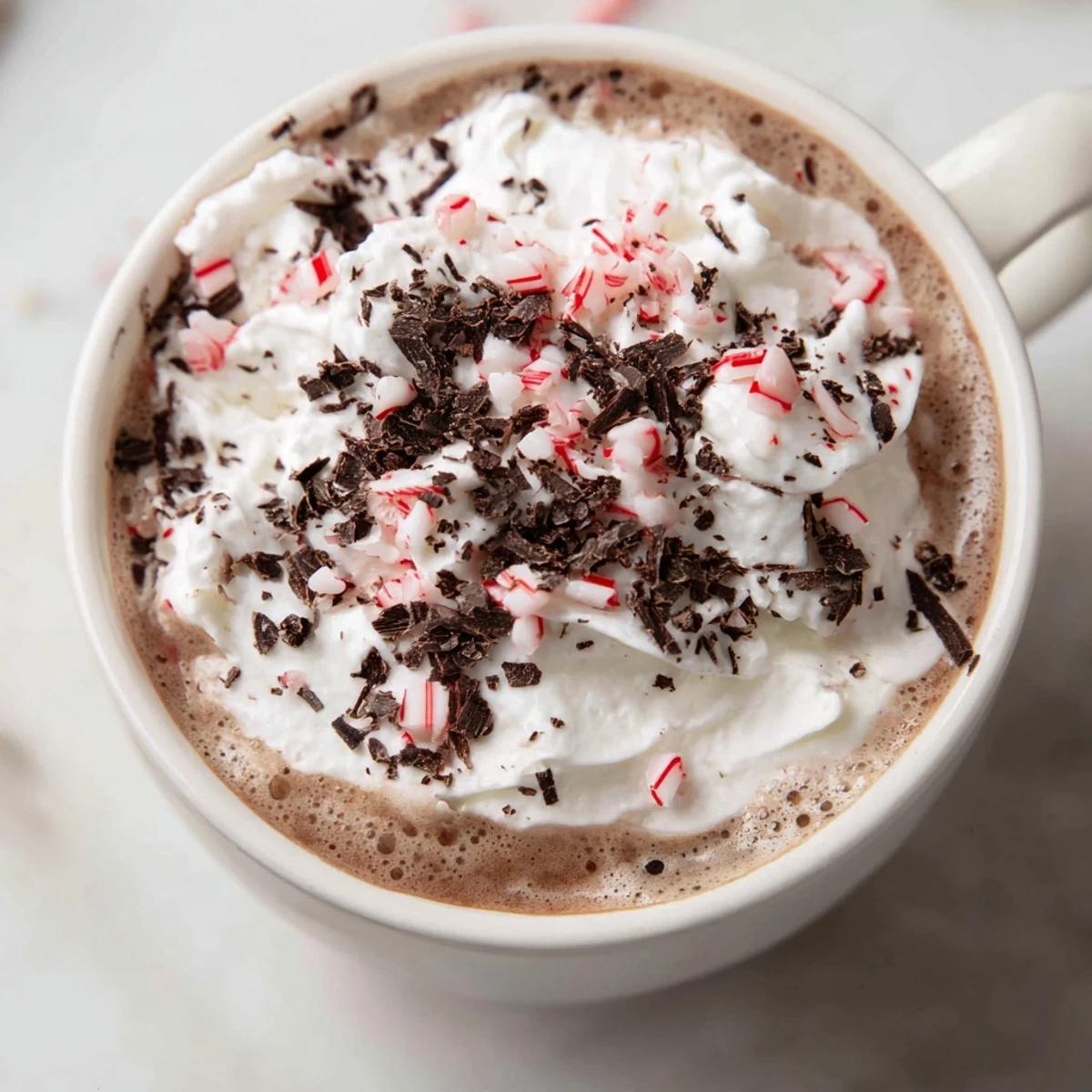 Enjoy a homemade Peppermint Mocha Latte: a delicious, festive coffee beverage ready to savor.