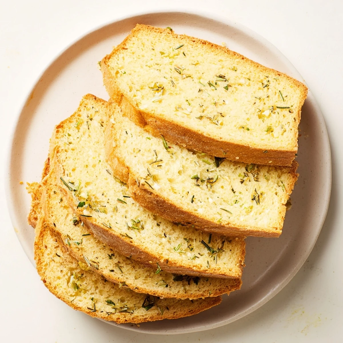 Aromatically baked Savory Herb Bread, crusty exterior revealing a soft, flavorful interior.