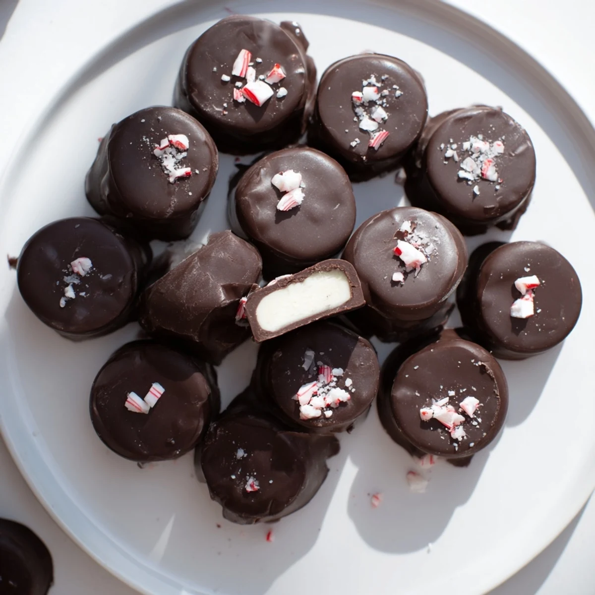 Velvety peppermint cream centers nestled within rich dark chocolate Peppermint Cream Chocolates, ready to serve.