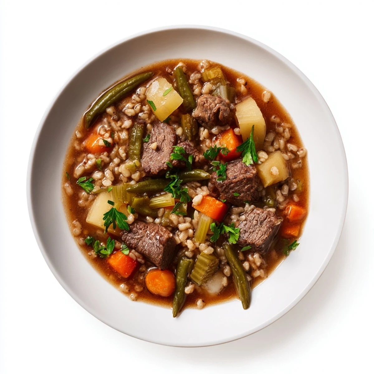 Enjoy a rich bowl of Hearty Beef and Barley Vegetable Stew, its tender beef and barley glistening.
