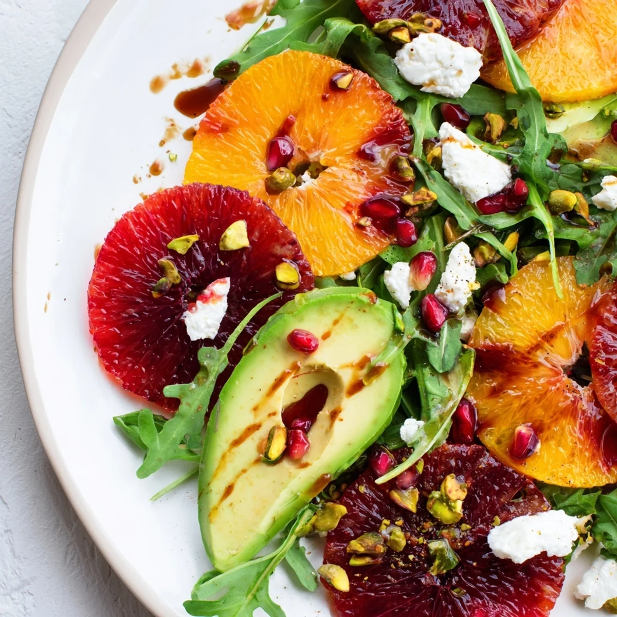 This Winter Citrus Salad features juicy citrus, creamy avocado, and a bright, tangy pomegranate dressing.
