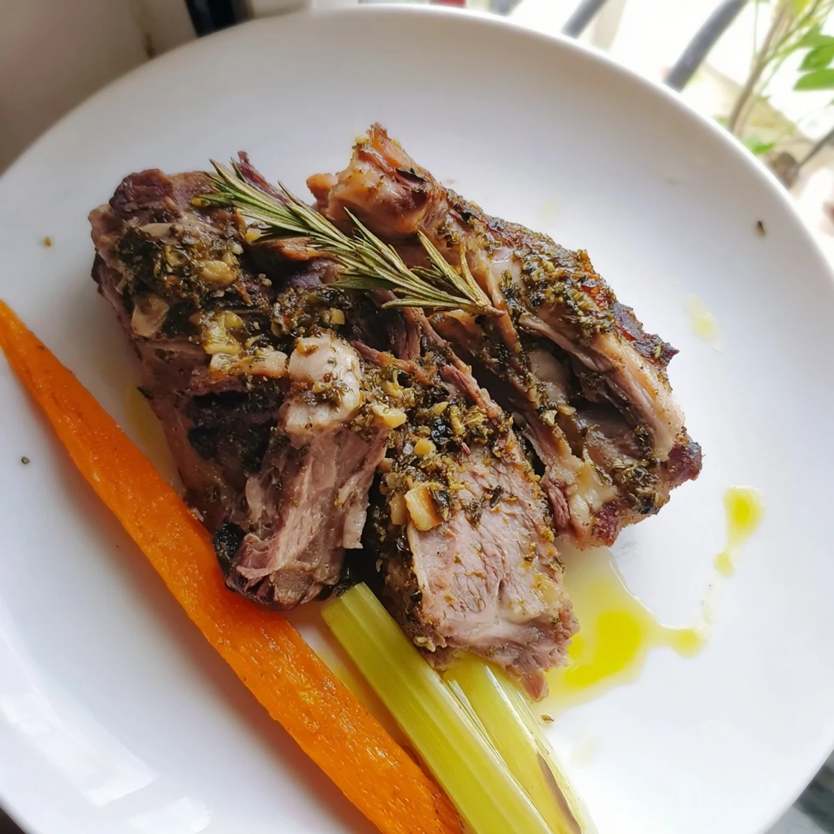 A close-up shows shredded, succulent Garlic Herb Roasted Lamb Shoulder with crispy edges, perfect for hearty family-style dinner servings.