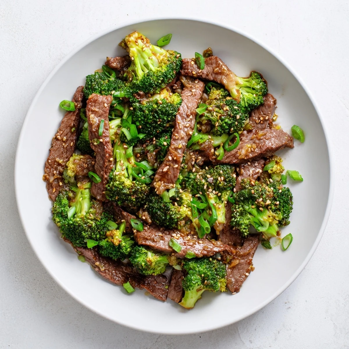 Freshly steamed beef and broccoli with ginger soy sauce glistening in a wok, ideal for quick weeknight dinners served with jasmine rice in this Beef and Broccoli Stir Fry with Ginger Soy Sauce.