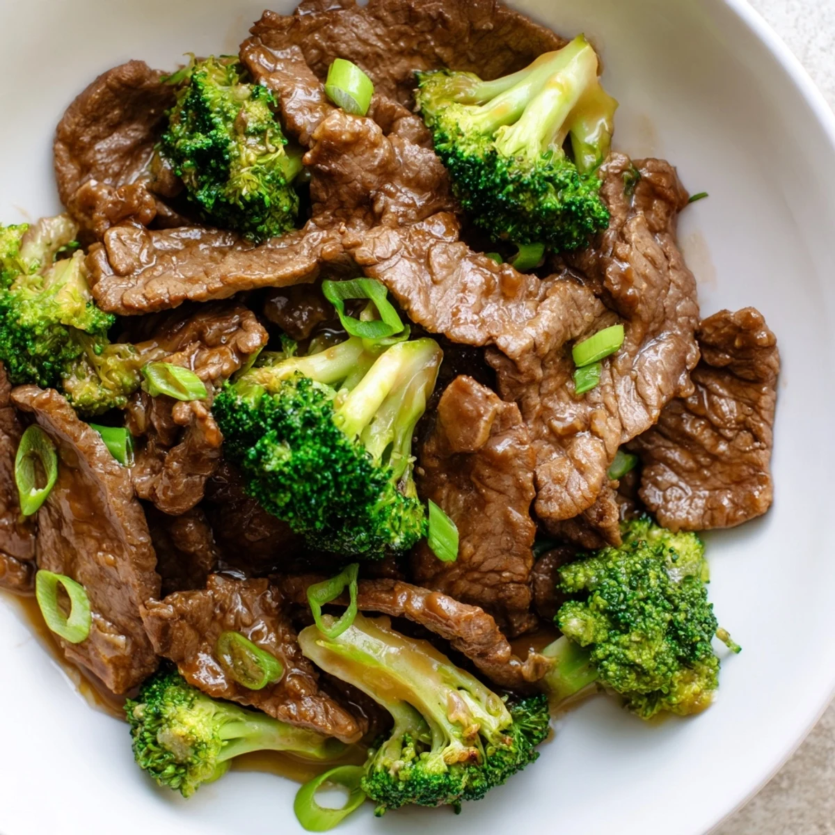 Close-up of Beef and Broccoli Stir Fry with Ginger Sauce highlighting the saucy texture, perfect for dairy-free Asian-inspired family meals.