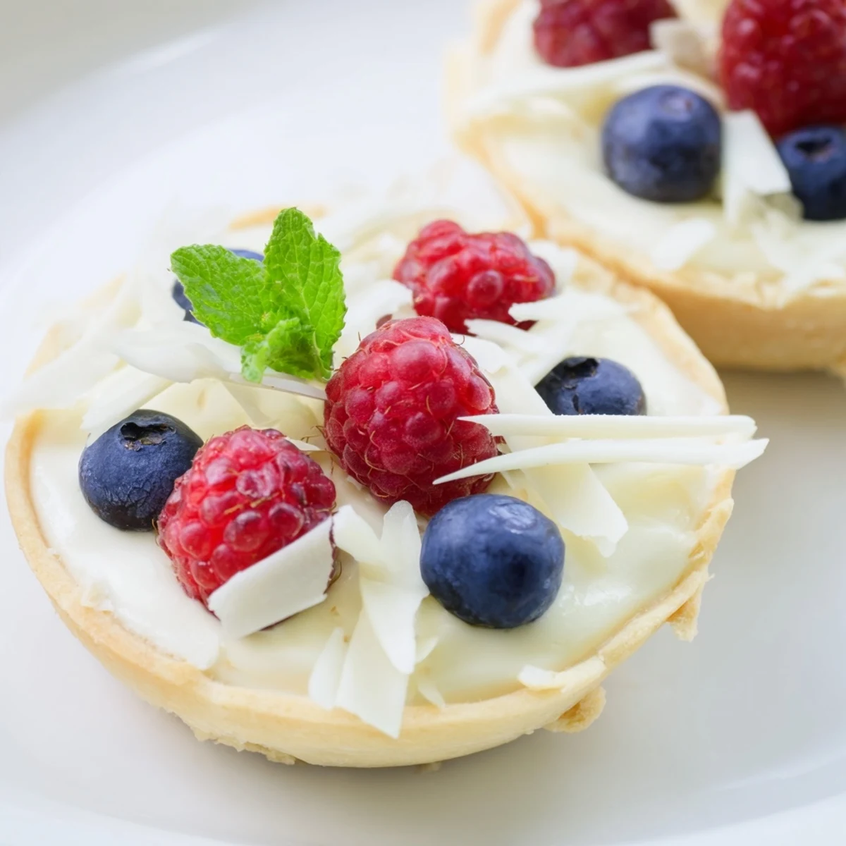 Elegant French dessert featuring silky white chocolate filling in crisp pastry shells