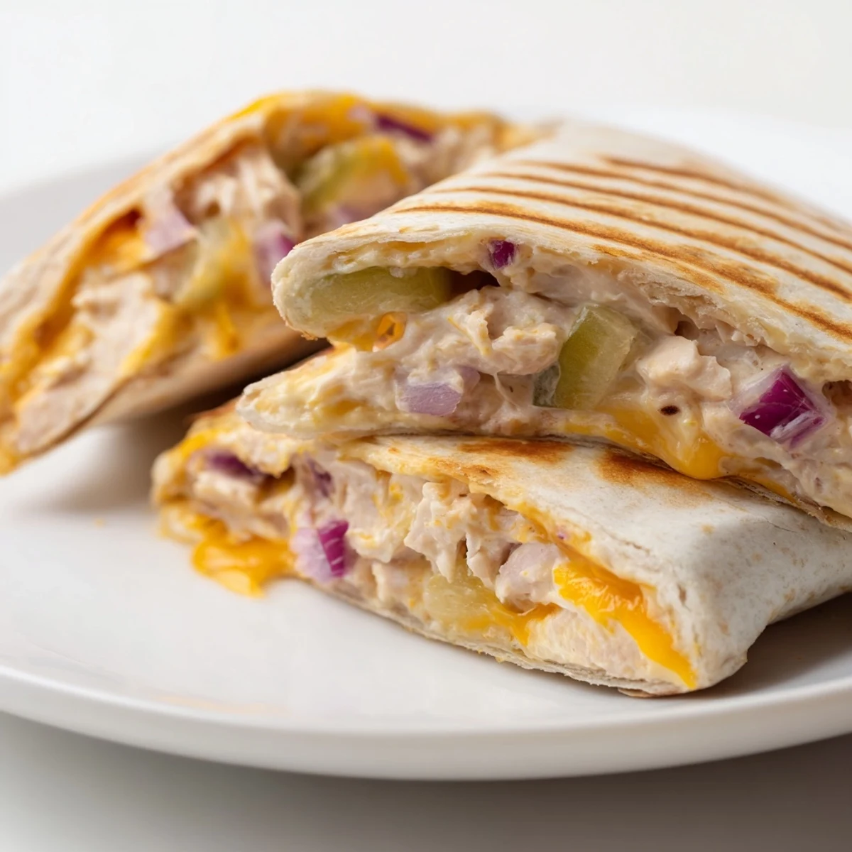 Warm flour tortilla stuffed with tuna salad and cheese toasted to crispy perfection