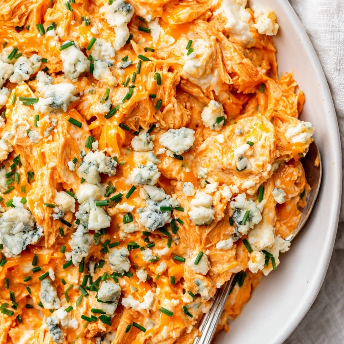 Golden shredded chicken breast coated in spicy buffalo sauce and ranch for a rich, party-ready appetizer