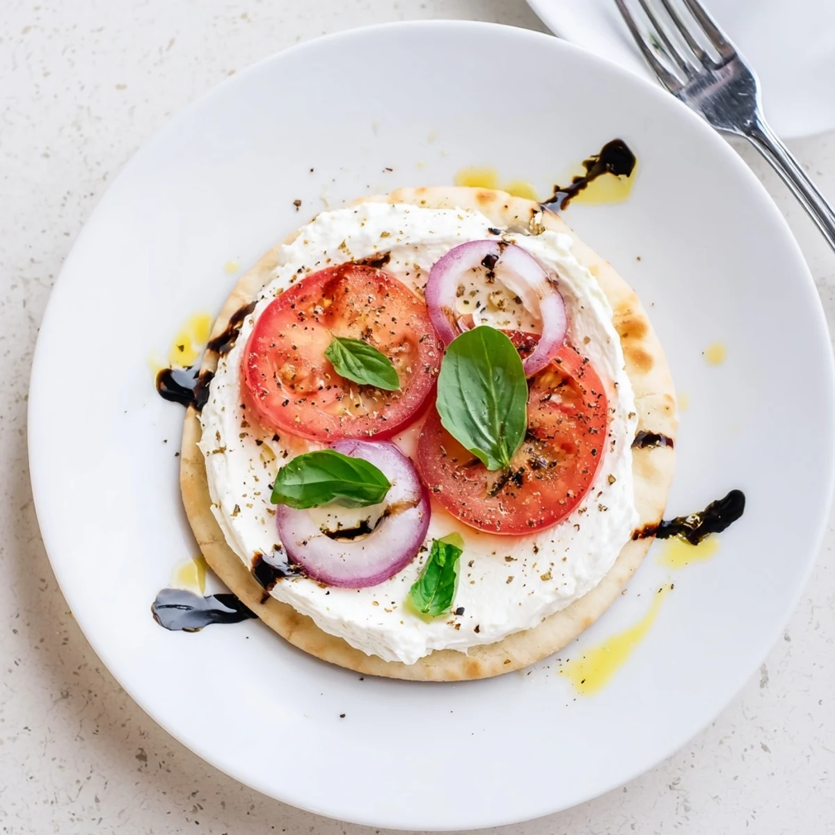 Quick Caprese Pita Pizza With Whipped Garlic Feta, crisp pita and creamy spread