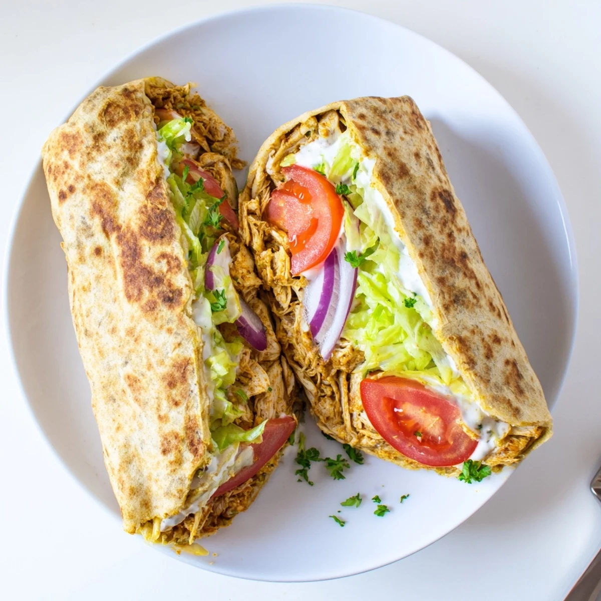 Protein-packed wrap featuring baked cottage cheese flatbread rolled with tender chicken and crisp veggies
